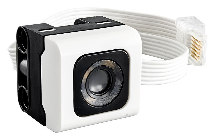 The color sensor — it reads which attachment is mounted